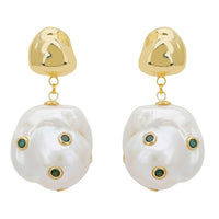 Gold drop earrings with white baroque pearl and green eye accents, in pair