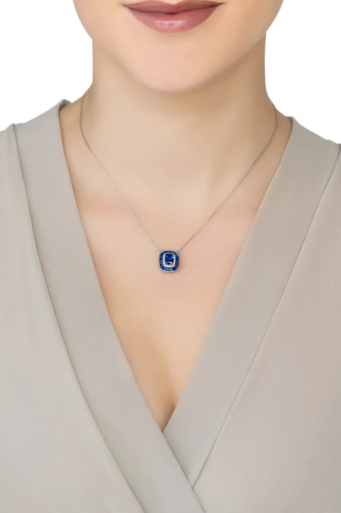 Sapphire pendant necklace with small blue square charm on silver chain
