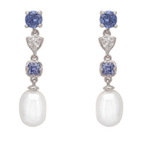Silver drop earrings with blue gemstone studs, pear-shaped pearl, and dangling charms
