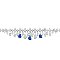 Silver tennis bracelet with blue teardrop stones and crystal drop links