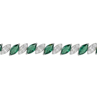 Row of oval emerald-green gemstones with silver prongs and clear stones