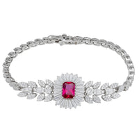Silver tennis bracelet with pink-red gemstone center and crystal leaf links