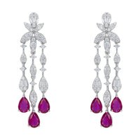 Silver drop chandelier earrings with purple teardrop stones and clear sparkle accents