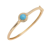Gold bangle bracelet with turquoise oval center and diamond accents
