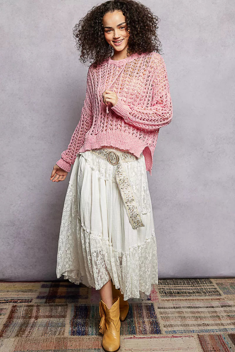 Pink openwork knit top with round neck and long sleeves, loose high-low cut
