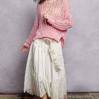 Pink openwork knit top with round neck and long sleeves, loose high-low cut