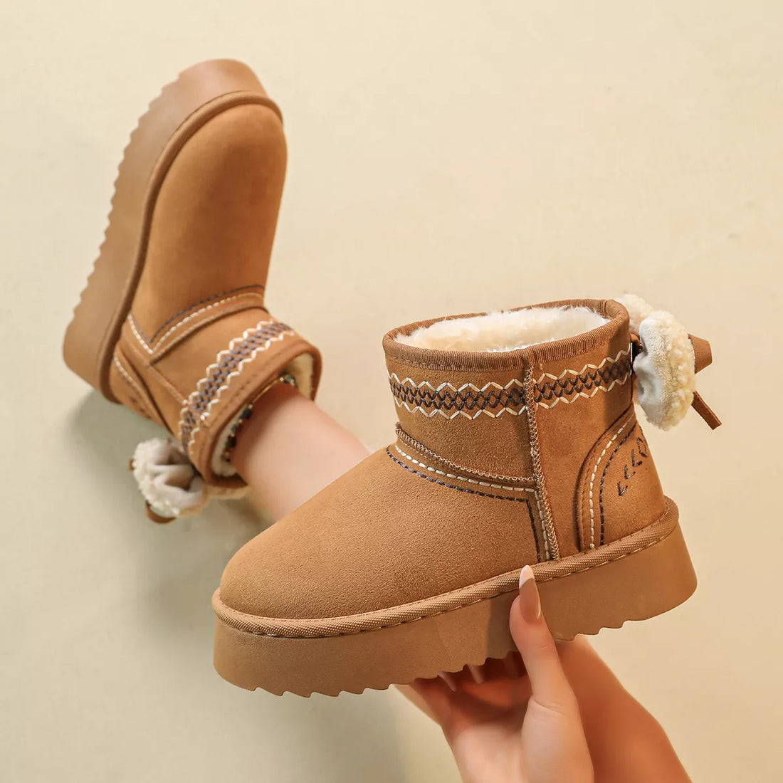 Camel suede platform boots with round toe, side stitching, shearling trim, lace ties