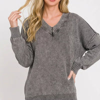 Washed dark gray oversized sweater with deep V-neck and relaxed fit