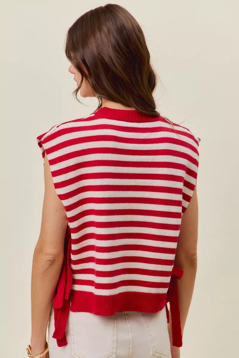 Back view of red and ivory striped sleeveless vest top with tied side fringe