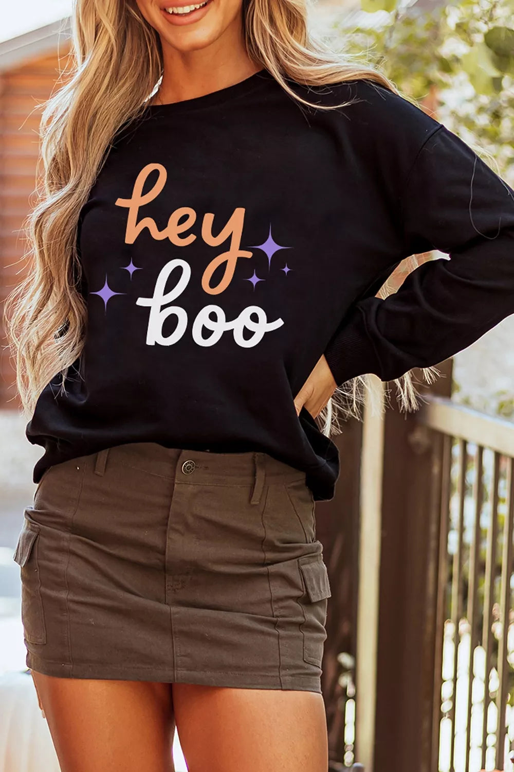 Black Halloween sweatshirt side view with &