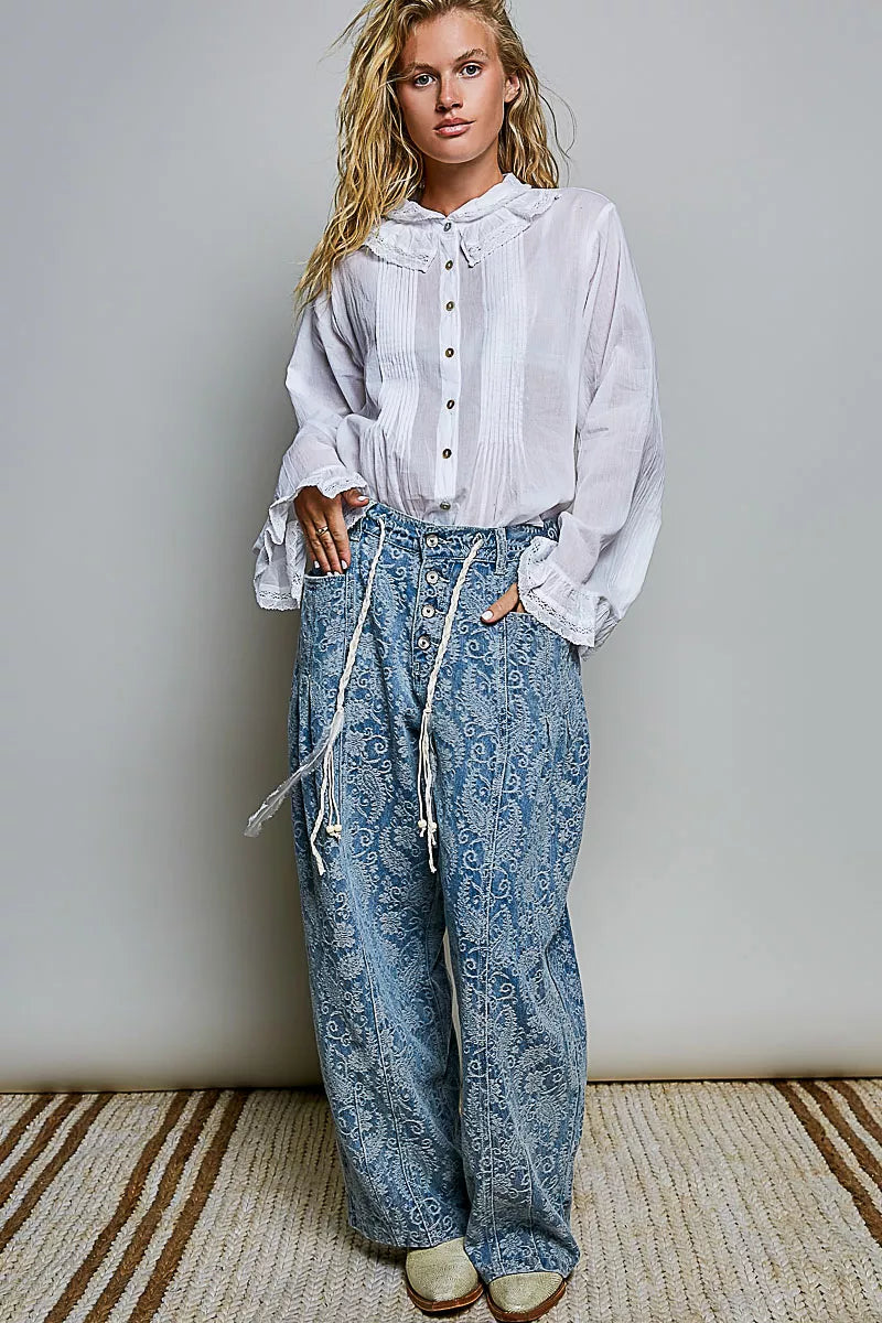 Ivory button-down shirt with long sleeves, pintuck detailing, and lace-trim cuffs