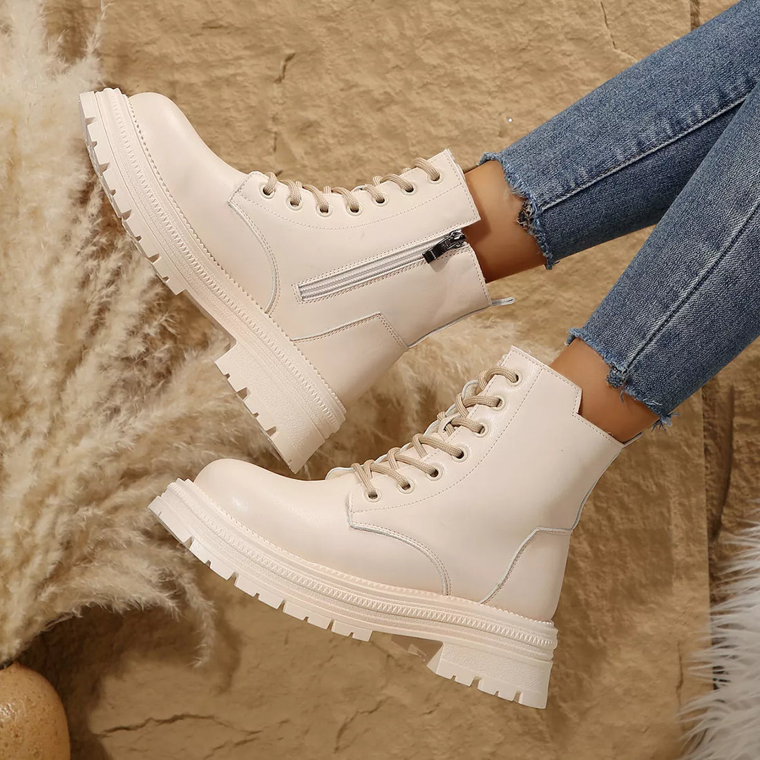 Off-white lace-up platform round-toe boots with side zip and padded collar