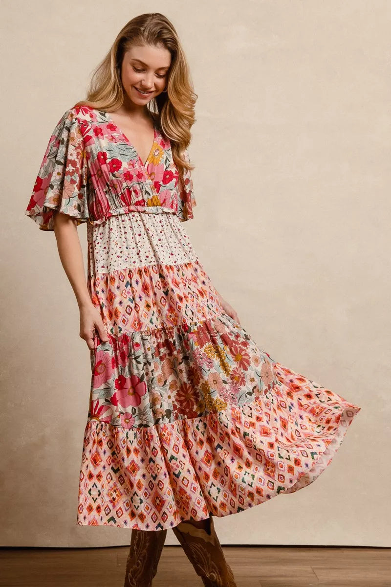 Floral print tiered midi dress with flowing skirt tiers and flutter sleeves