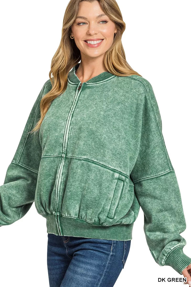 Dark green acid-washed fleece jacket with zip collar and ribbed cuffs