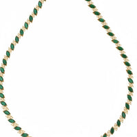 Gold-tone tennis necklace featuring emerald-green teardrop links, curved laid out