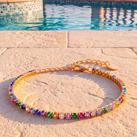 Gold rainbow CZ tennis bracelet with heart-shaped toggle clasp
