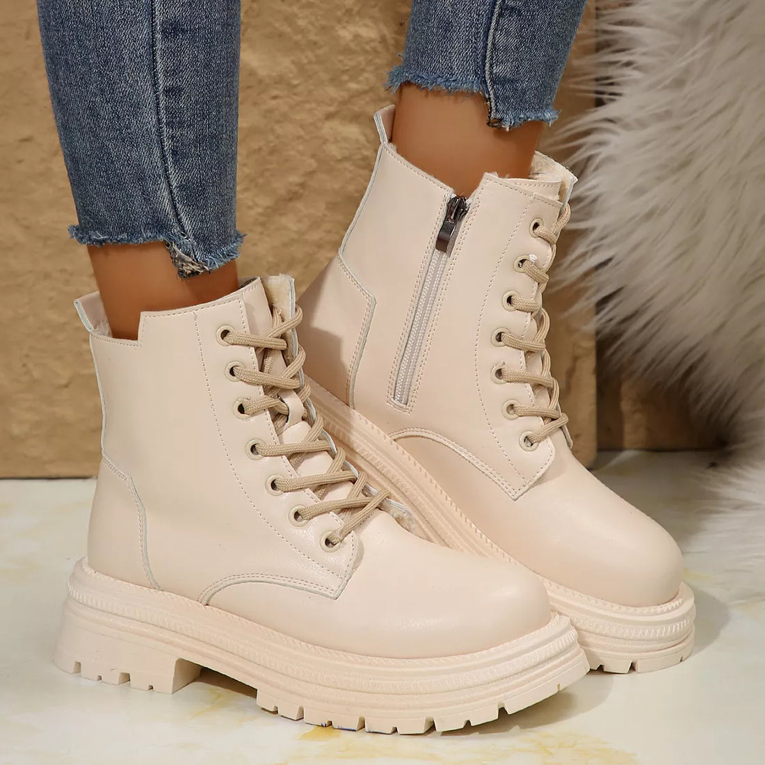 Off-white lace-up platform round-toe boots with side zipper and chunky tread