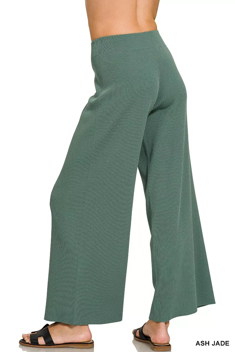 Teal-green wide-leg pants with elastic waistband and flowing drape