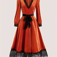 Orange-red velvet V-neck midi dress with black lace trim, waist tie bow, three-quarter sleeves