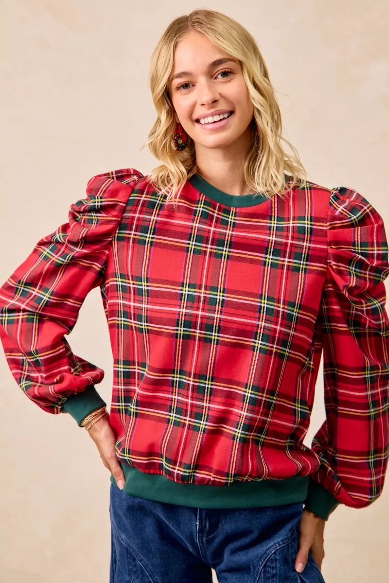 Red plaid top with exaggerated puff shoulders and green crew neckline