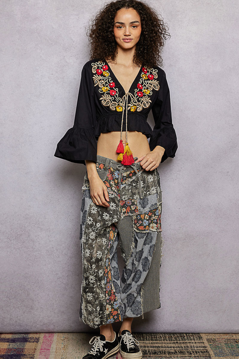 Black cropped blouse with floral embroidery V-neck and tassel cord
