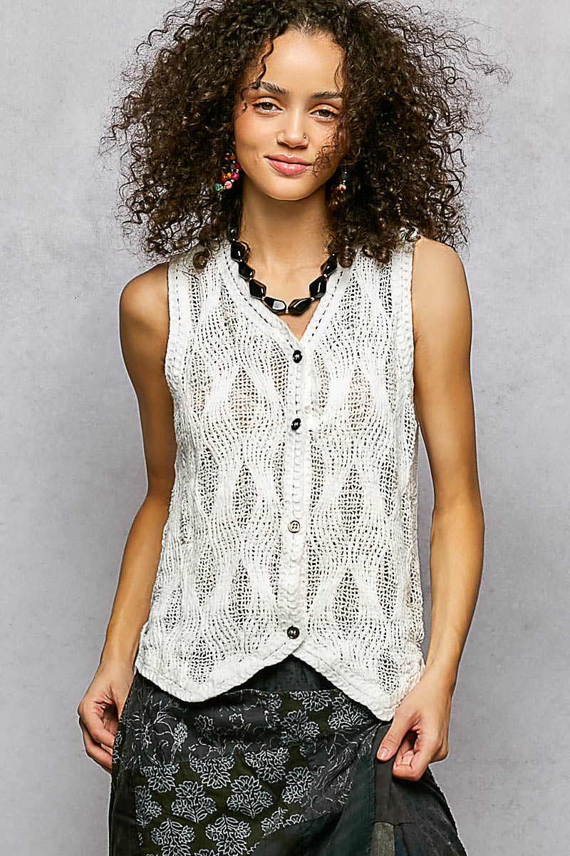 Off-white sleeveless V-neck sweater vest with front buttons and textured knit pattern