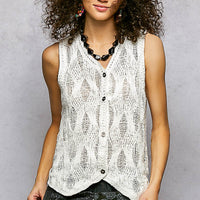 Off-white sleeveless V-neck sweater vest with front buttons and textured knit pattern