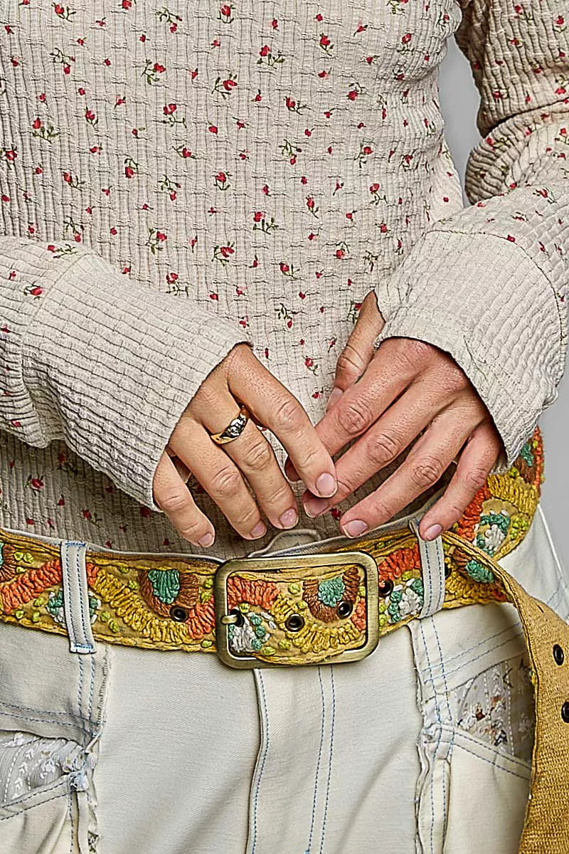 Ribbed knit top with mini floral print and textured long sleeves, hands detail