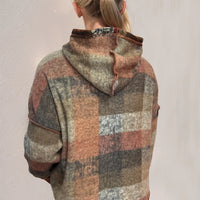 Plaid fleece hoodie with hood and half-zip, dropped shoulders, back view.