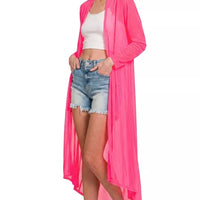 Fuchsia mesh open-front cardigan over denim shorts with long sleeves