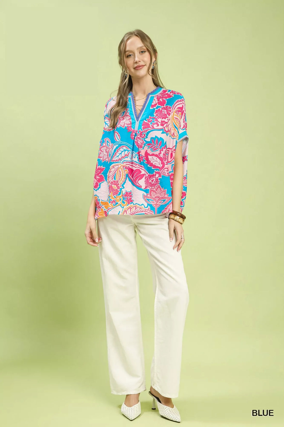 Oversized blue printed top with pink floral paisley, V-neck placket, short sleeves