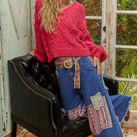 Fuchsia cable-knit cropped V-neck sweater, long sleeves with ribbed cuffs and hem