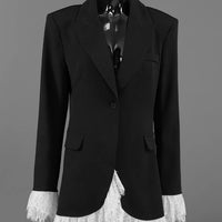 Black lace-hem one-button blazer on a mannequin, flap pockets