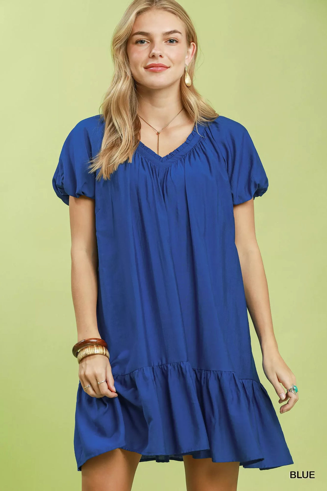Blue ruffle-hem shift mini dress with V-neck and short puff sleeves.