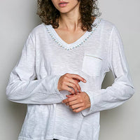 Off white V-neck long-sleeve knit top with contrast hand-stitched trim and chest pocket.