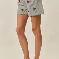 Light-wash denim shorts with rose embroidery and high-rise waistband