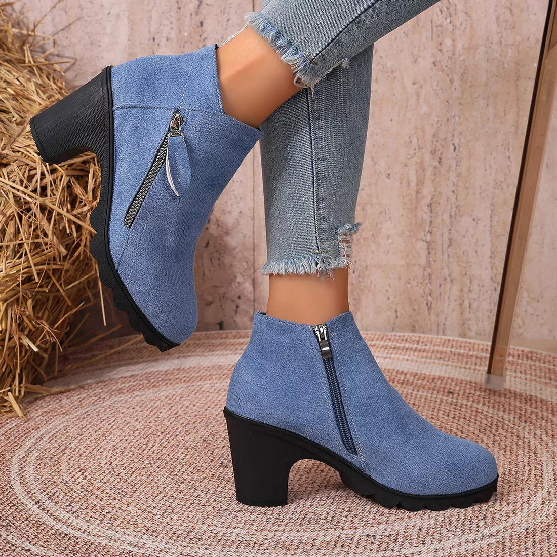 Blue suede block-heel ankle boots with round toe and side zipper closure