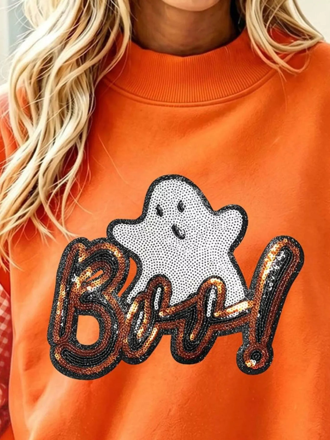Orange sweatshirt close-up: sequin &
