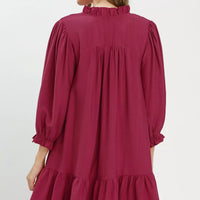 Mulberry mini dress back view with gathered yoke, smocked collar, tiered ruffle hem