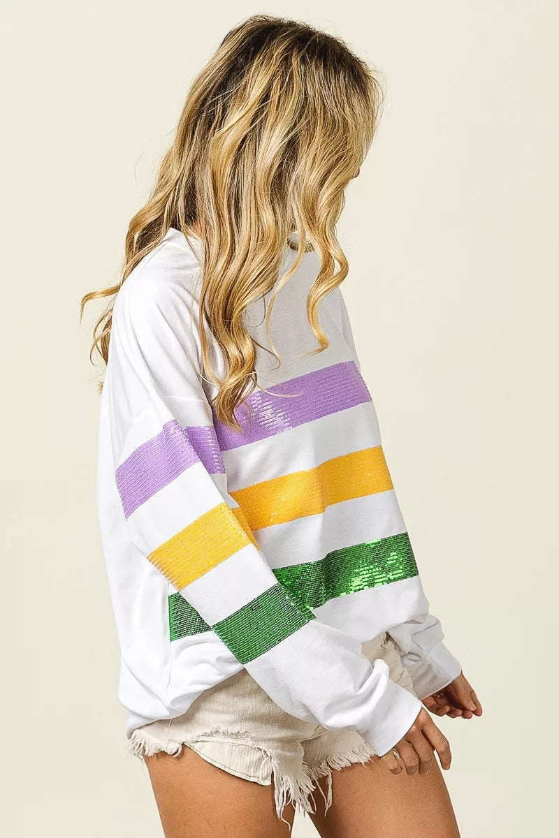 Off-white sweatshirt with sequined purple, yellow, and green striped sleeves and back