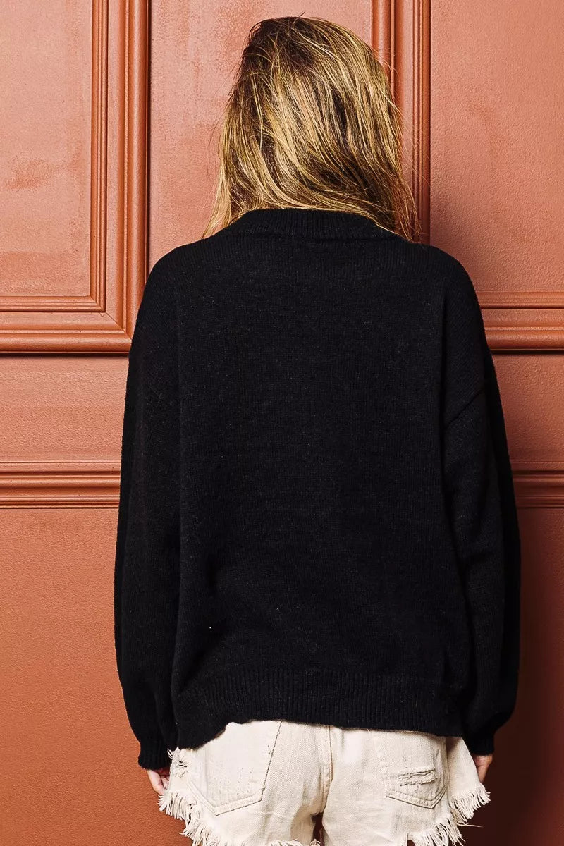 Black sweater back view with ribbed cuffs and hem, no visible front graphic