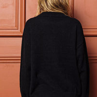 Black sweater back view with ribbed cuffs and hem, no visible front graphic
