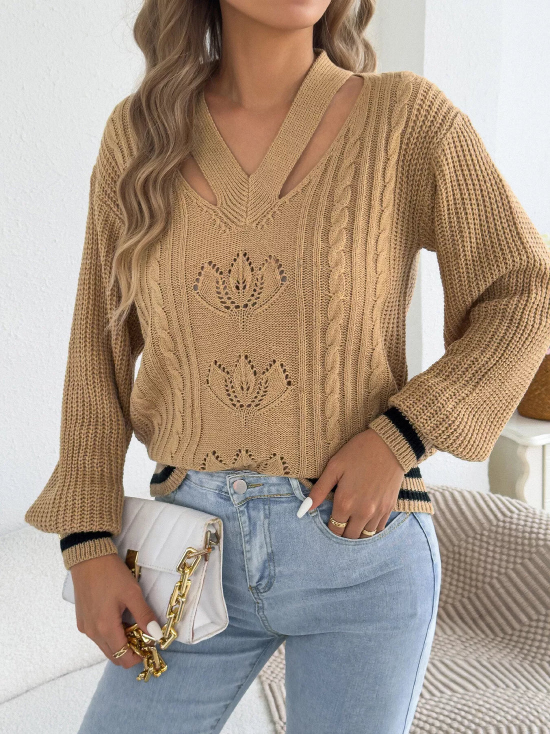Camel V-neck cutout cable knit sweater with knit floral motifs and ribbed hem