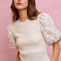 White knit sweater top with puff floral contrast sleeves and scalloped hemline