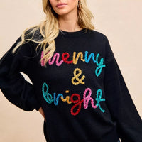 Black Christmas sweater with multicolor sparkle "Merry & Bright" lettering on front