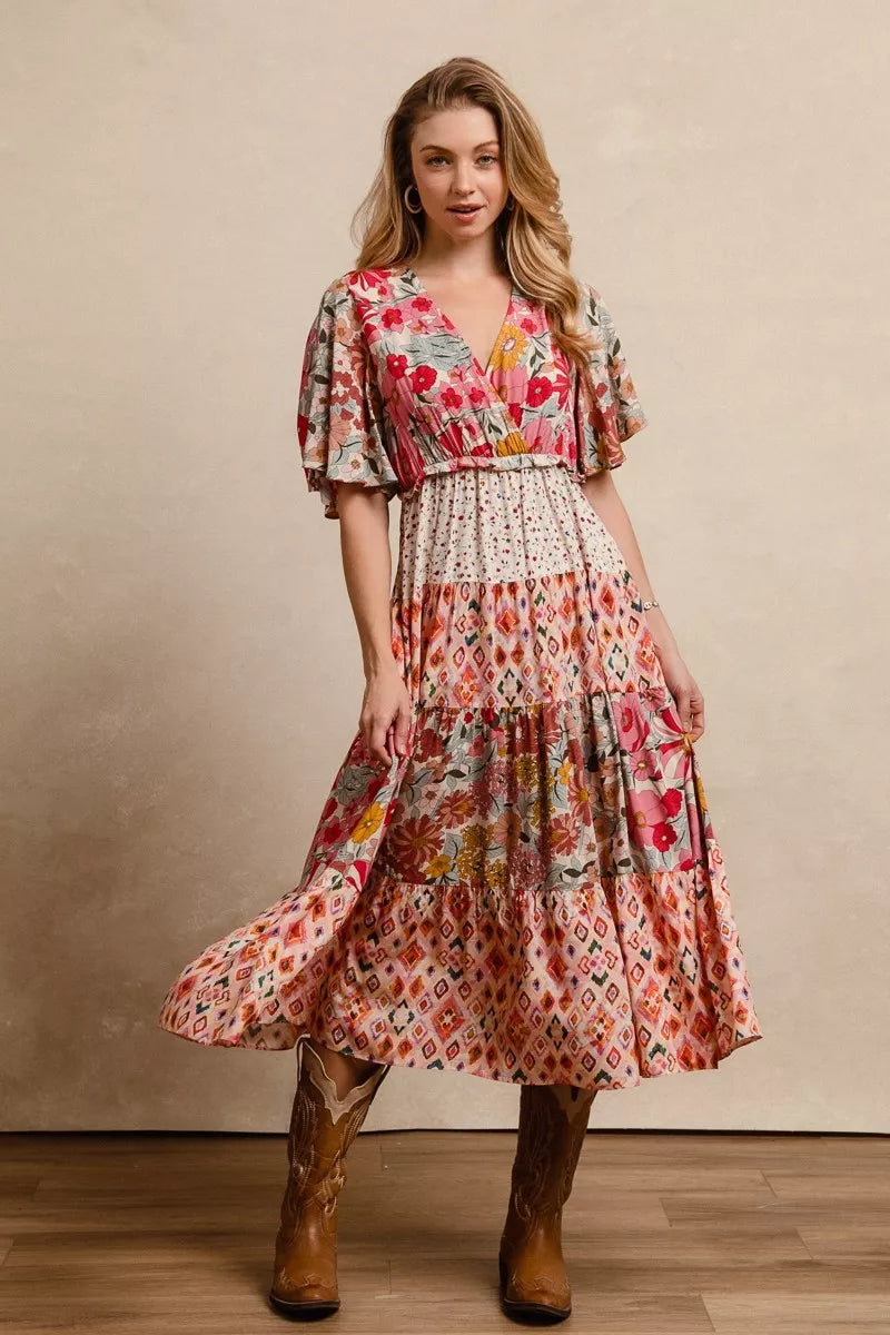Floral print tiered midi dress with flutter sleeves, gathered waist, and midi length
