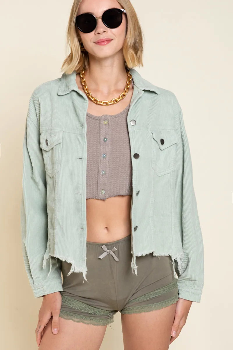 Sage corduroy button-front trucker jacket with chest flap pockets, snap buttons, frayed edges