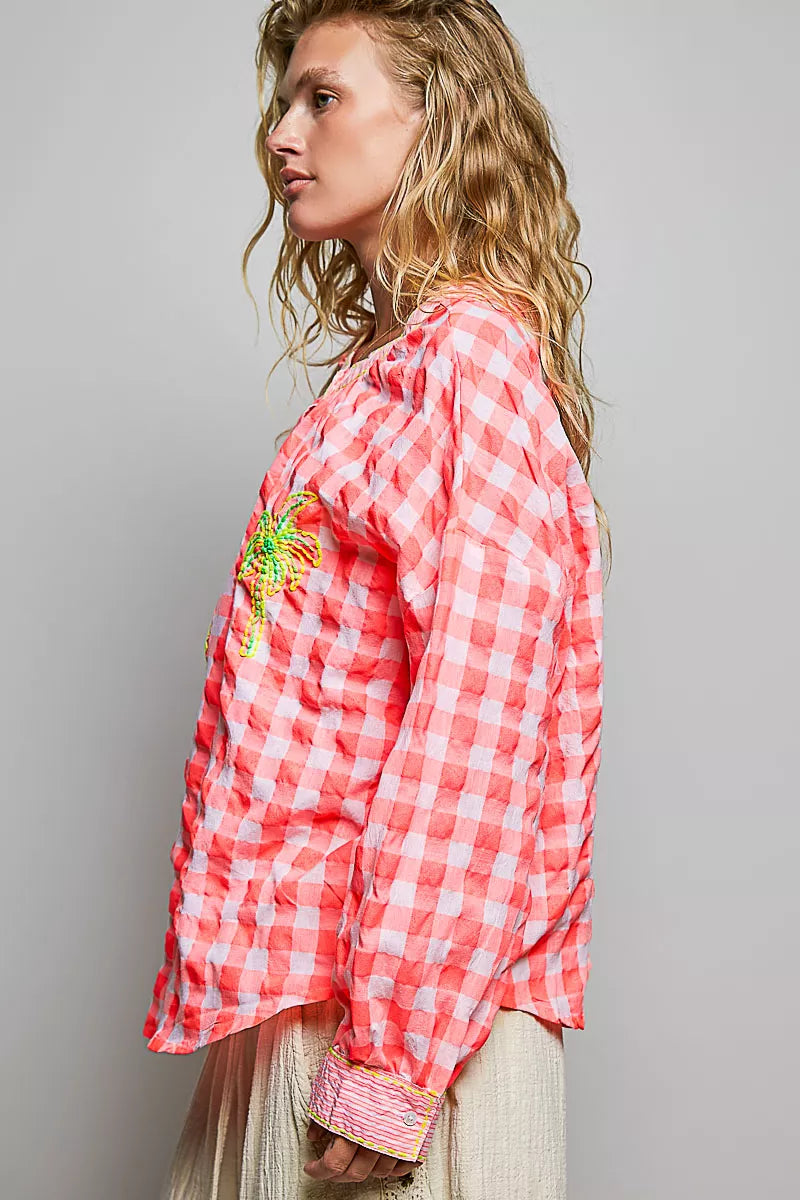 Pink gingham embroidered blouse, side view with palm tree front detail
