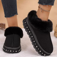 Black faux fur lined platform ankle boots, front and side views with star trim