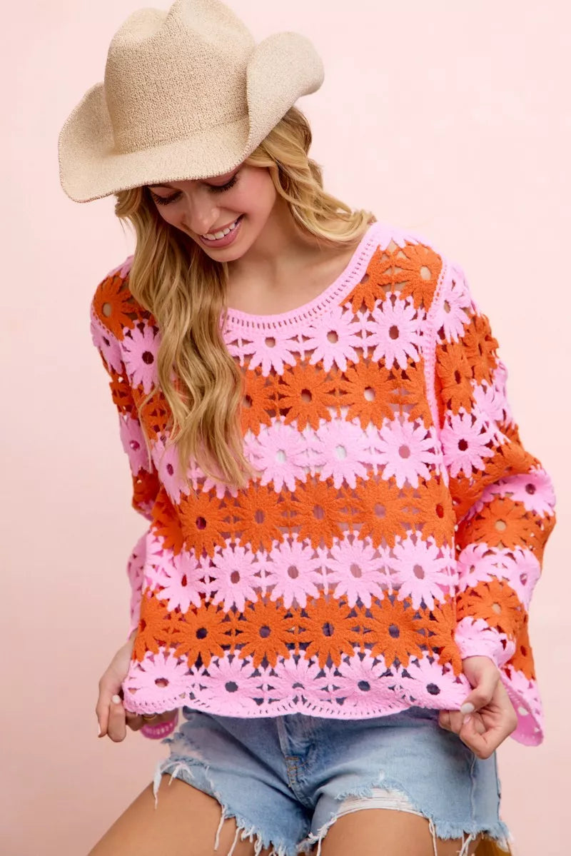 Orange and pink floral crochet knit top with long sleeves, scoop neckline and scalloped hem.